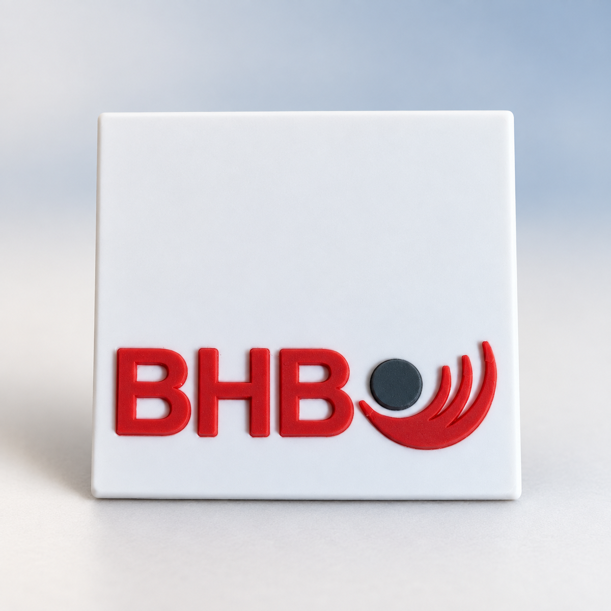 White custom silicone label with raised red BHB logo