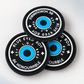 Round custom silicone labels with detailed blue, black and white design