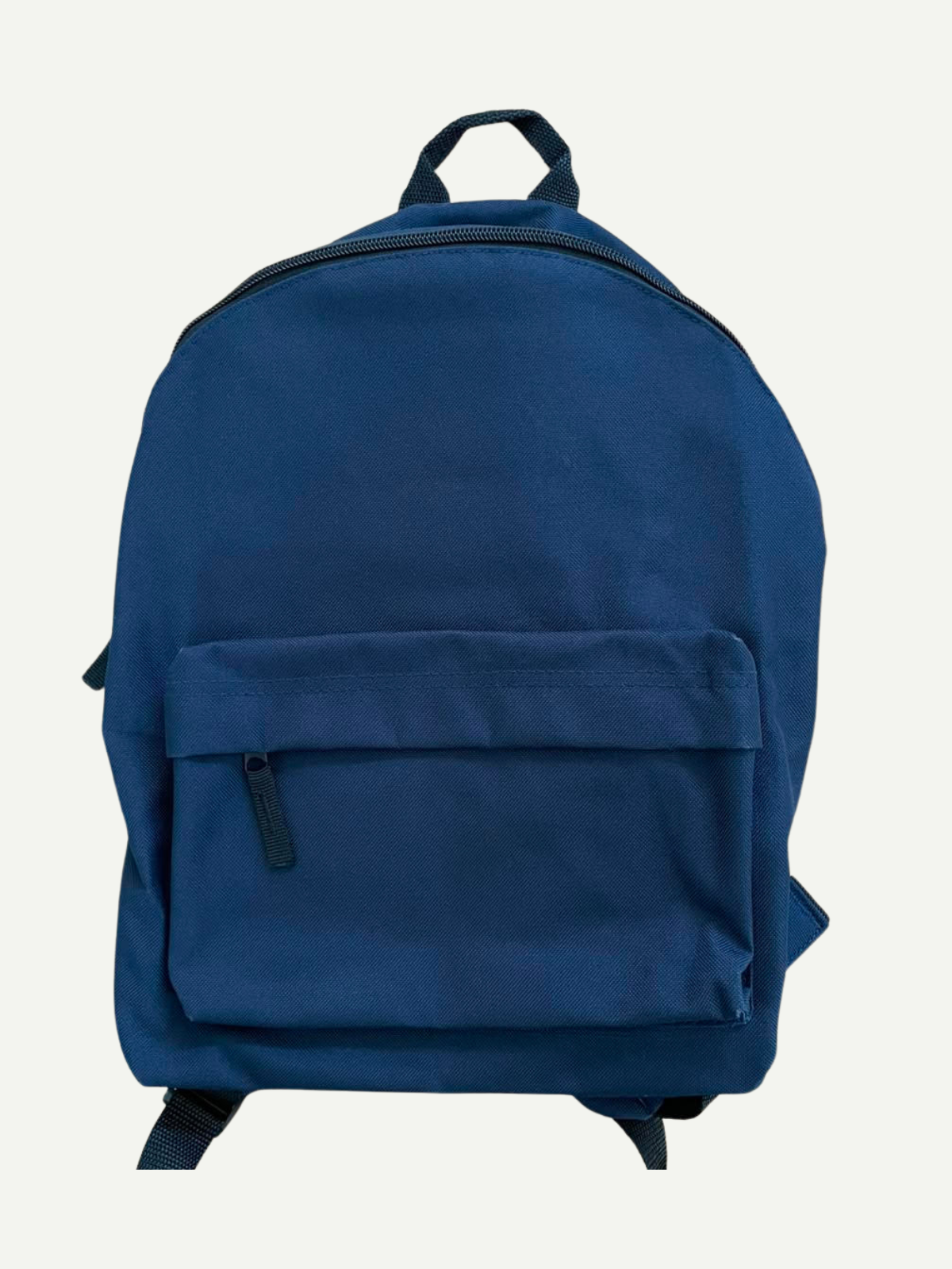 Plain blue children’s backpack with a front zipped pocket and top carry handle, shown before personalisation.