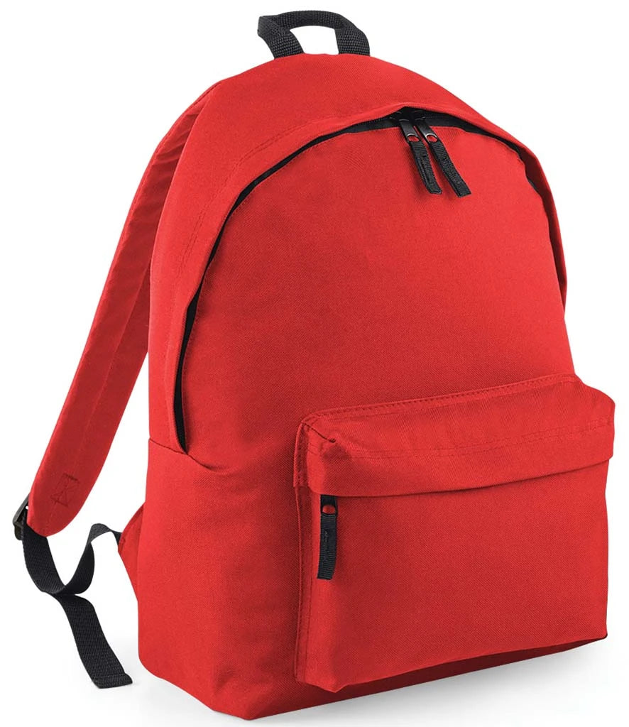 Plain bright red children’s backpack shown at an angle, with black trim, a front zipped pocket and padded shoulder strap.
