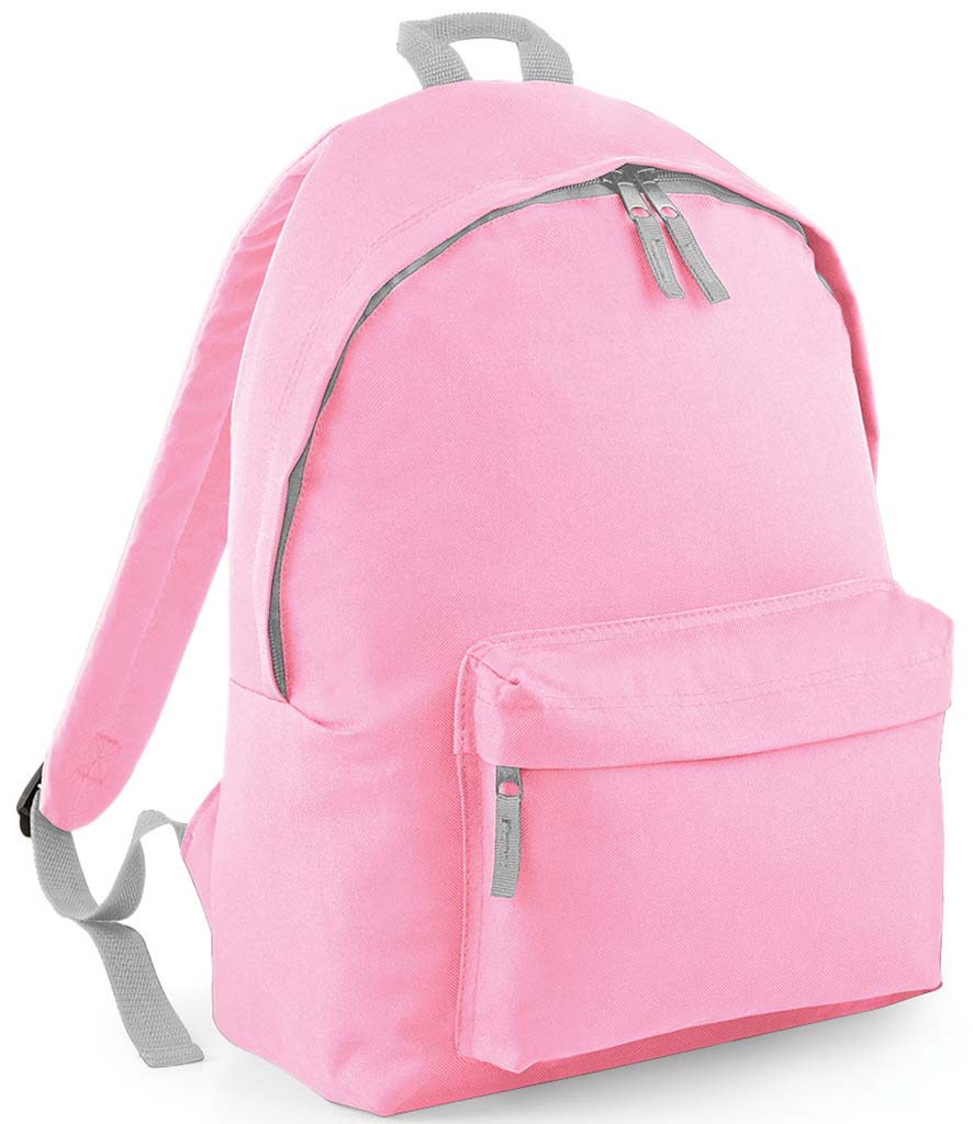Plain pink children’s backpack shown at an angle, with grey trim, a front zipped pocket and padded shoulder strap.