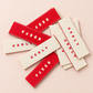Red and cream personalised woven clothing labels with custom CIELY branding