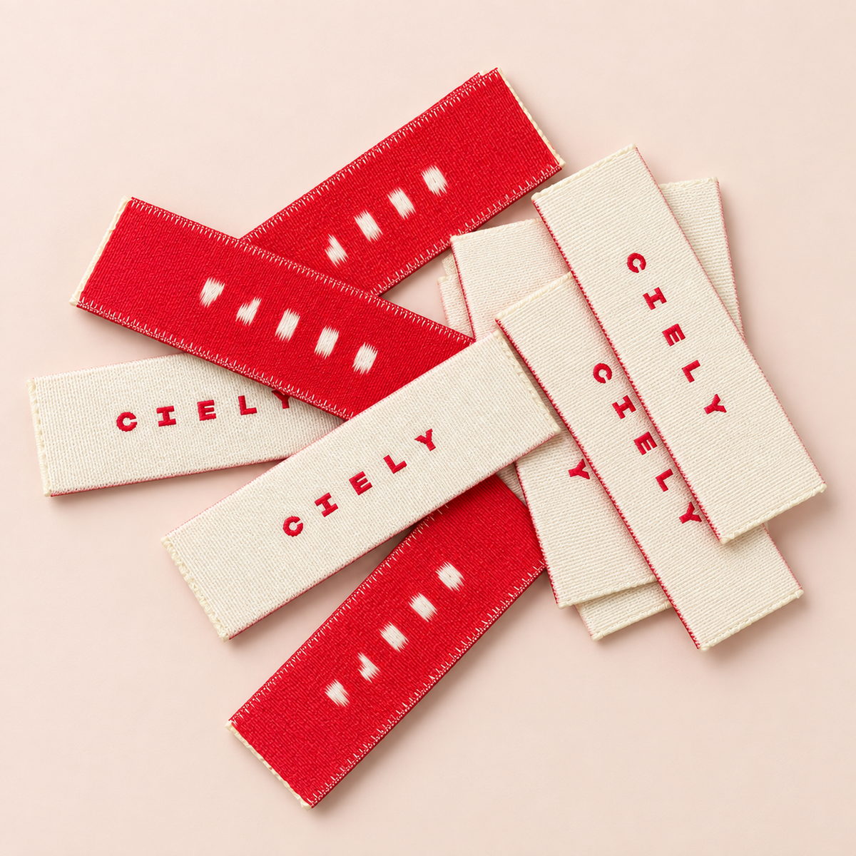 Red and cream personalised woven clothing labels with custom CIELY branding