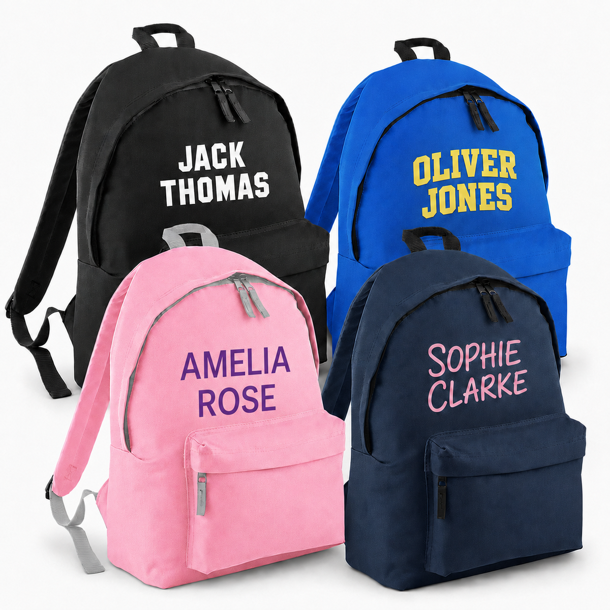 Four personalised children’s backpacks in black, royal blue, pink and navy, each printed with a name in a different font and colour.