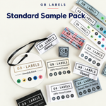 GB Labels Standard Sample Pack showing woven labels, printed cotton labels and a swing tag on a cream background.