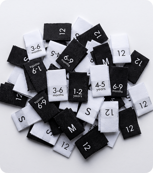 Black and white woven clothing size tabs for garments