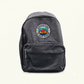 Custom embroidered Adventure Is Out There badge on a grey backpack