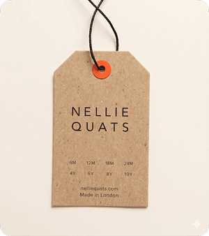 Custom printed kraft swing tag with Nellie Quats branding, children’s size guide, black cord and orange eyelet