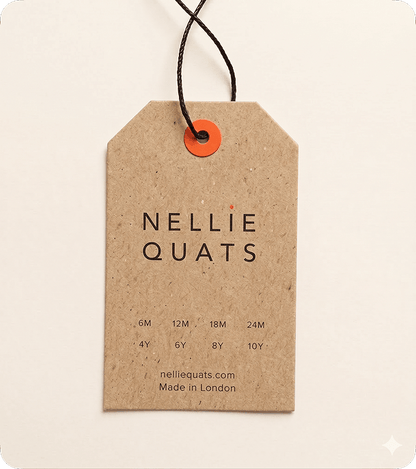 Custom printed kraft swing tag with Nellie Quats branding, children’s size guide, black cord and orange eyelet