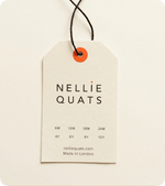 Custom recycled pulp swing tag with black cord and orange eyelet