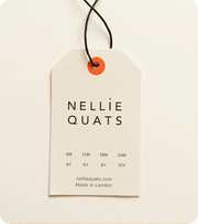 Custom recycled pulp swing tag with black cord and orange eyelet
