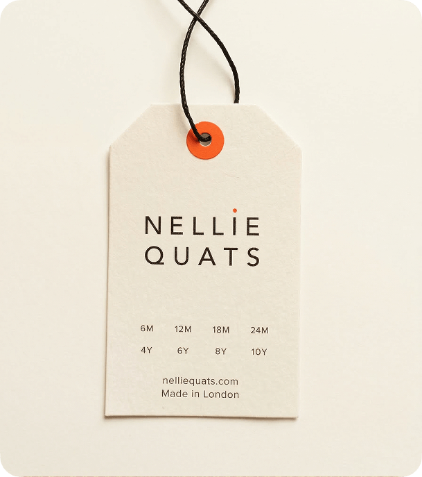 Custom recycled pulp swing tag with black cord and orange eyelet