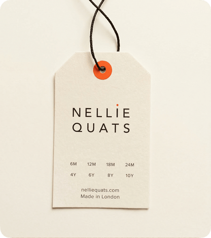 Custom recycled pulp swing tag with black cord and orange eyelet