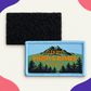 Custom woven Highlands trail badge with separate black hook-and-loop backing