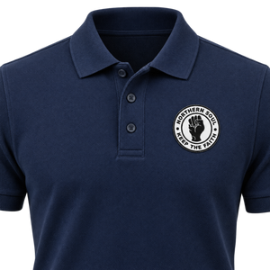 Custom woven self-adhesive badge applied to a navy polo shirt